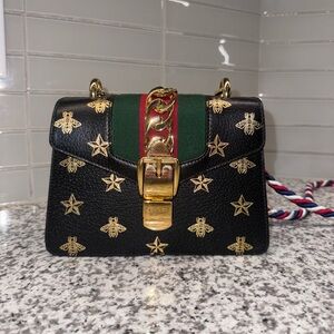 Authentic Gucci Textured Calfskin Bee Star Print Small Sylvie Should Bag - Black